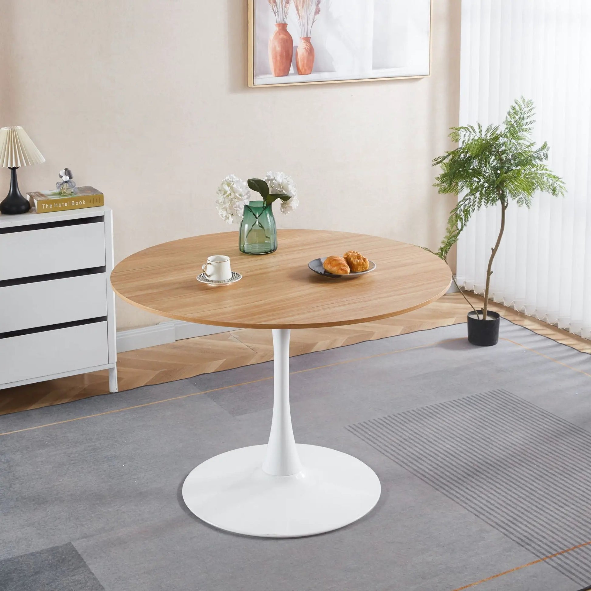Mid-Century Tulip Dining Table with Round Top, light wood top and white pedestal base on Tampa Home & Garden Store