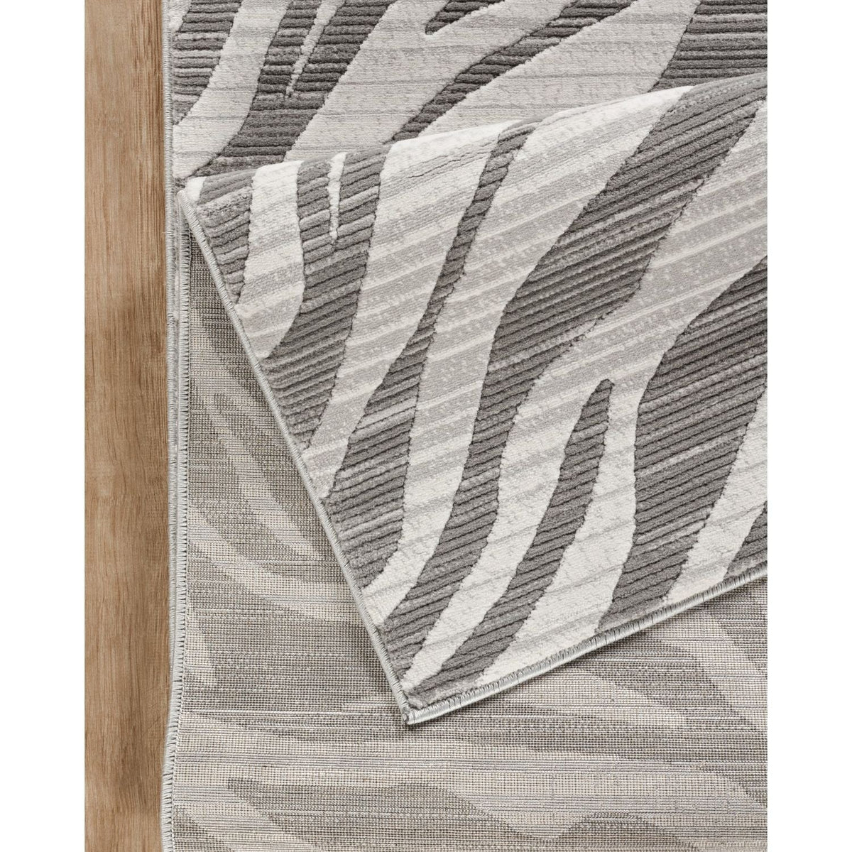 Gray geometric area rug with ultra-soft fibers in a modern neutral palette on Tampa Home & Garden Store