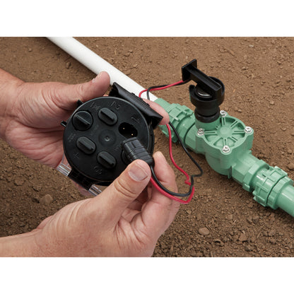 Battery-powered sprinkler controller, black unit with red wires for underground irrigation on Tampa Home & Garden Store
