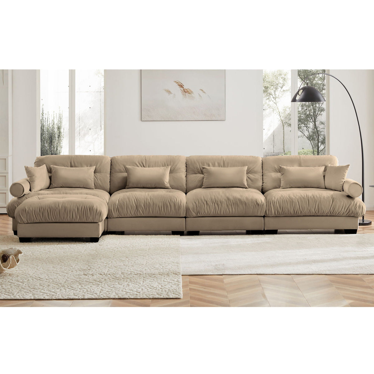Beige modern sectional sofa with ottoman, round bolster arms and plush pillows on Tampa Home & Garden Store