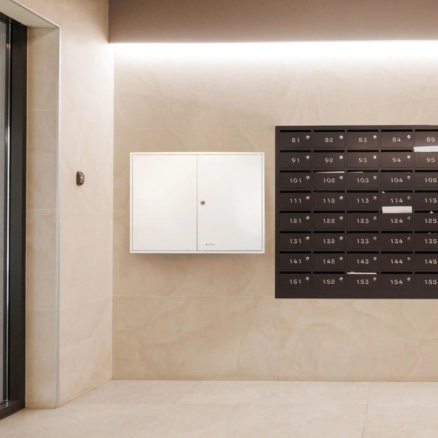 White adjustable key cabinet with lock mounted beside black mailbox grid Unique Piece Furniture on Tampa Home & Garden Store