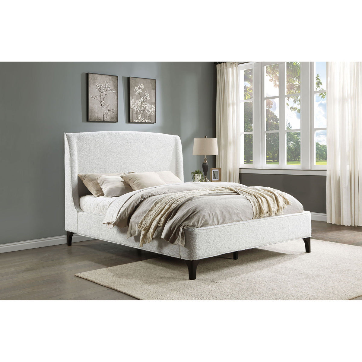 Theodore Wingback Bed white upholstered by HouseOfZazla in a gray bedroom with neutral bedding and large windows on Tampa Home & Garden Store