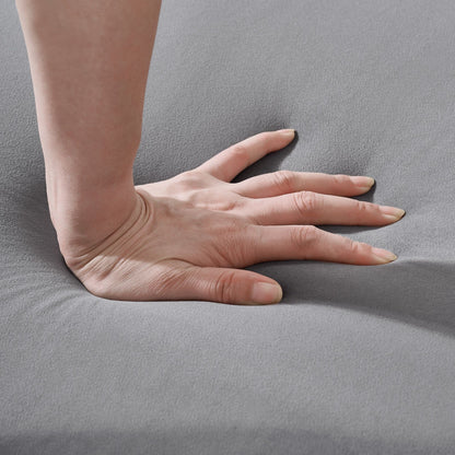 Chesterfield upholstery fabric sofa close-up in gray with hand for scale on Tampa Home & Garden Store