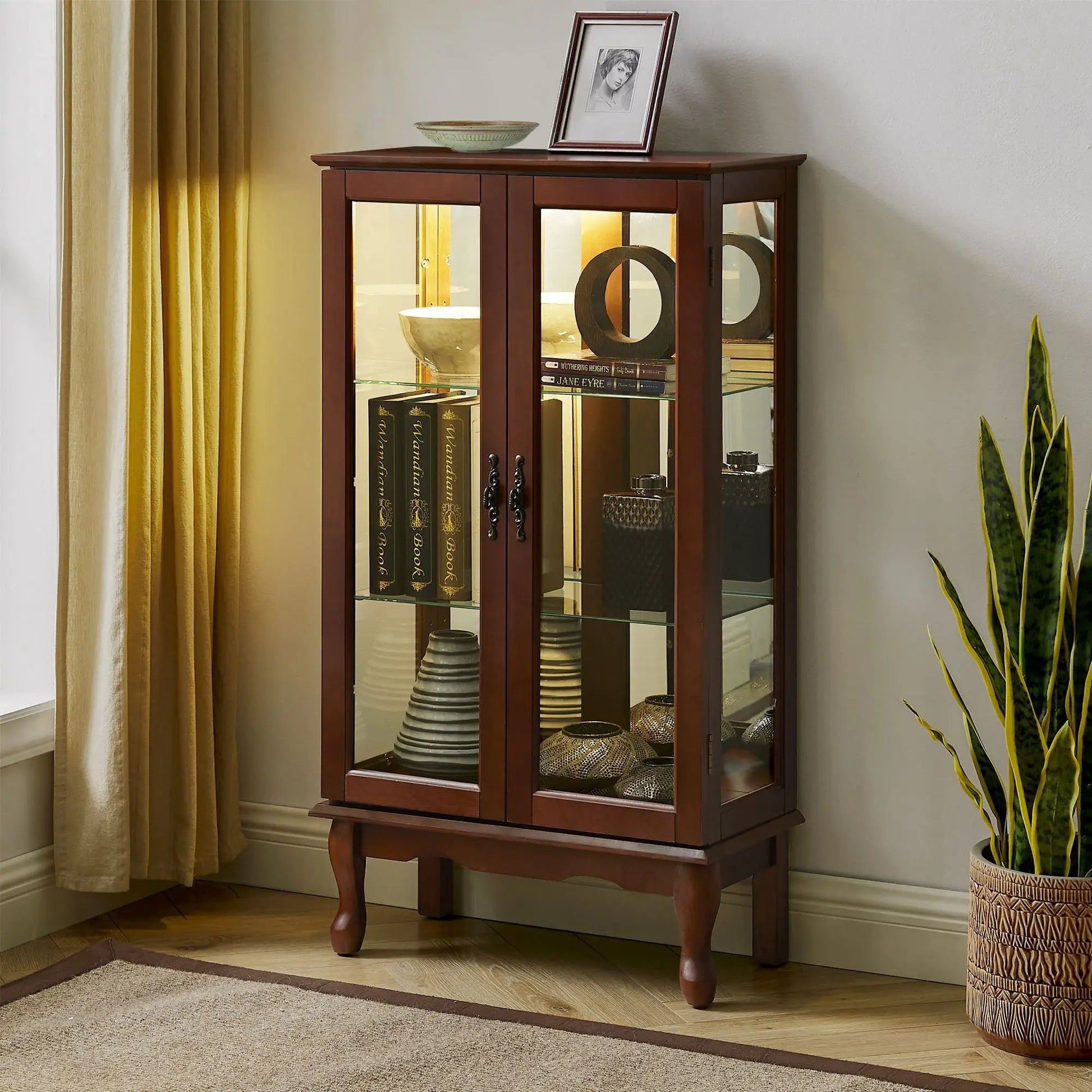 Curio cabinet with lighted interior tempered glass doors, mirrored back, adjustable shelves on Tampa Home & Garden Store