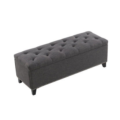 Button-tufted storage ottoman in dark gray fabric with nailhead trim by HouseOfZazla on Tampa Home & Garden Store