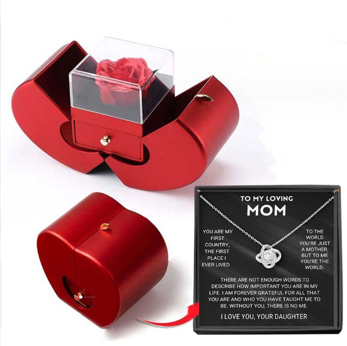 Red apple jewelry box with clear lid showing a red rose; necklace gift display on Tampa Home & Garden Store