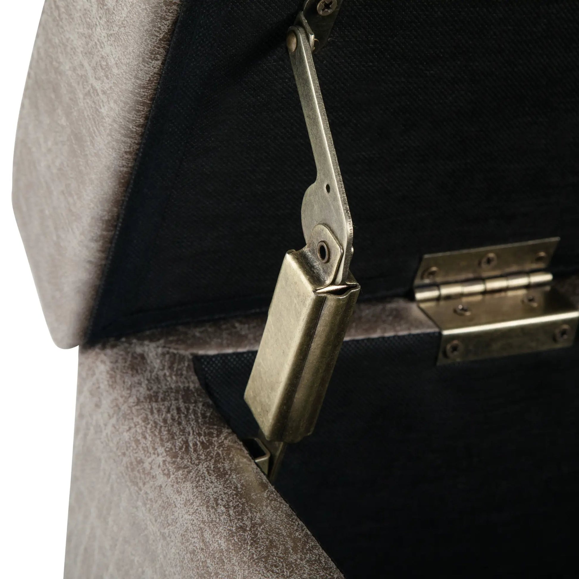 Avalon multifunctional storage ottoman bench close-up of brushed metal hinge on dark upholstery on Tampa Home & Garden Store