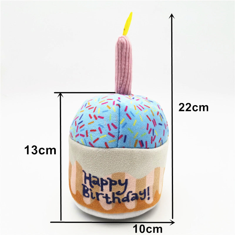Cute Dog Birthday Cake Plush Toy with blue frosting, rainbow sprinkles, pink candle on Tampa Home & Garden Store
