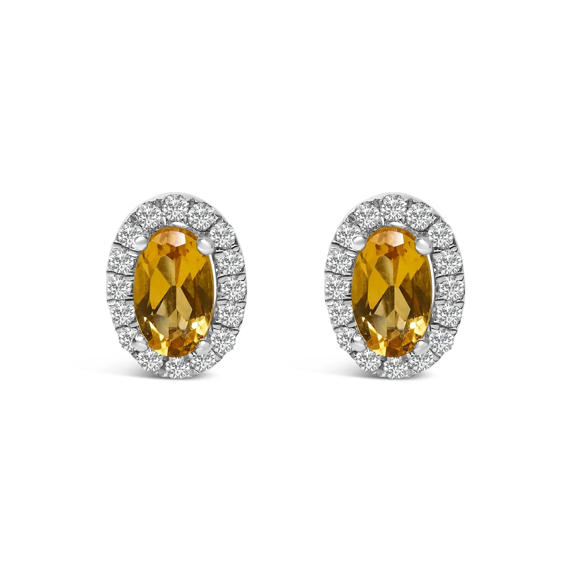 White gold oval yellow gemstone stud earrings with diamond halo by Bids.com on Tampa Home & Garden Store