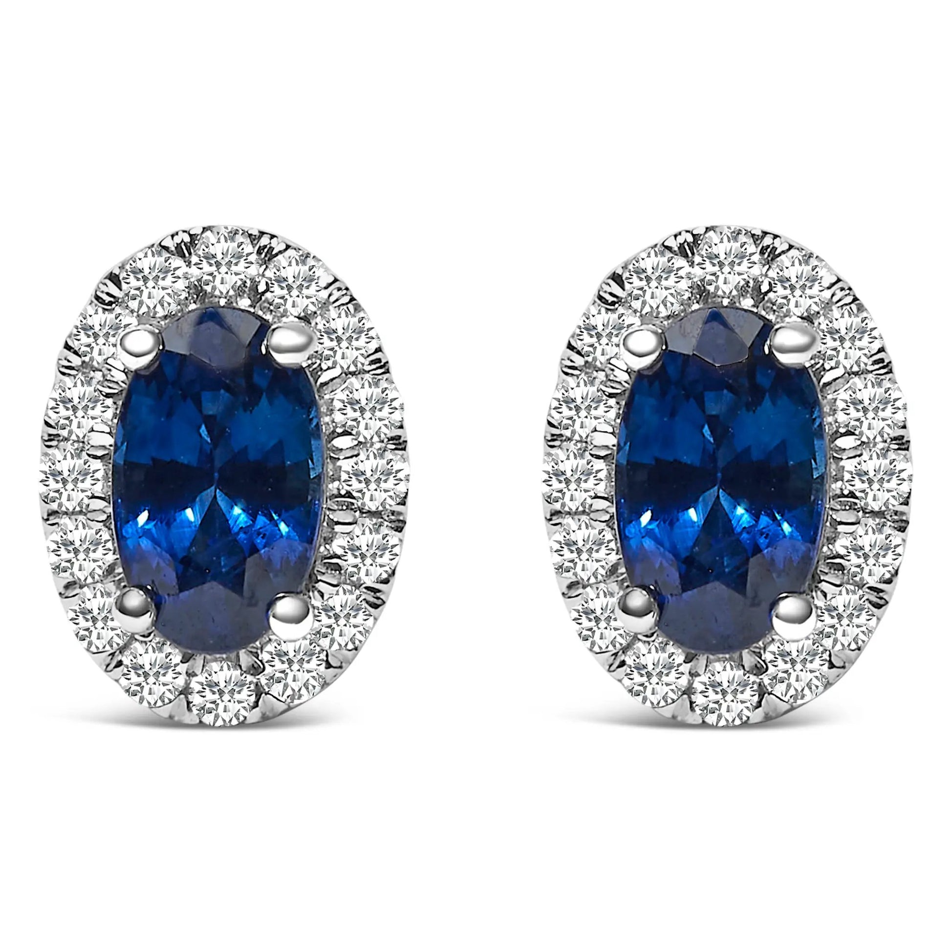 Pair of 10K white gold oval blue gemstone stud earrings with diamond halo by Bids.com on Tampa Home & Garden Store