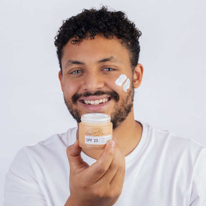 UpCircle Cleanse, Tone + Moisturize Set jar with SPF 25 held by man, cheek cream swatches on Tampa Home & Garden Store