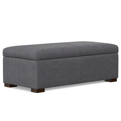 Gabbie storage ottoman gray upholstered fabric with tufted top and dark wood legs on Tampa Home & Garden Store