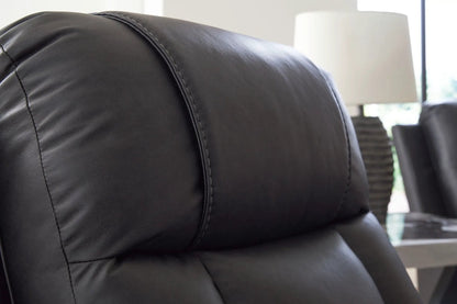 Mackmenville reclining sofa leather cushions in black with prominent stitched seams on Tampa Home & Garden Store
