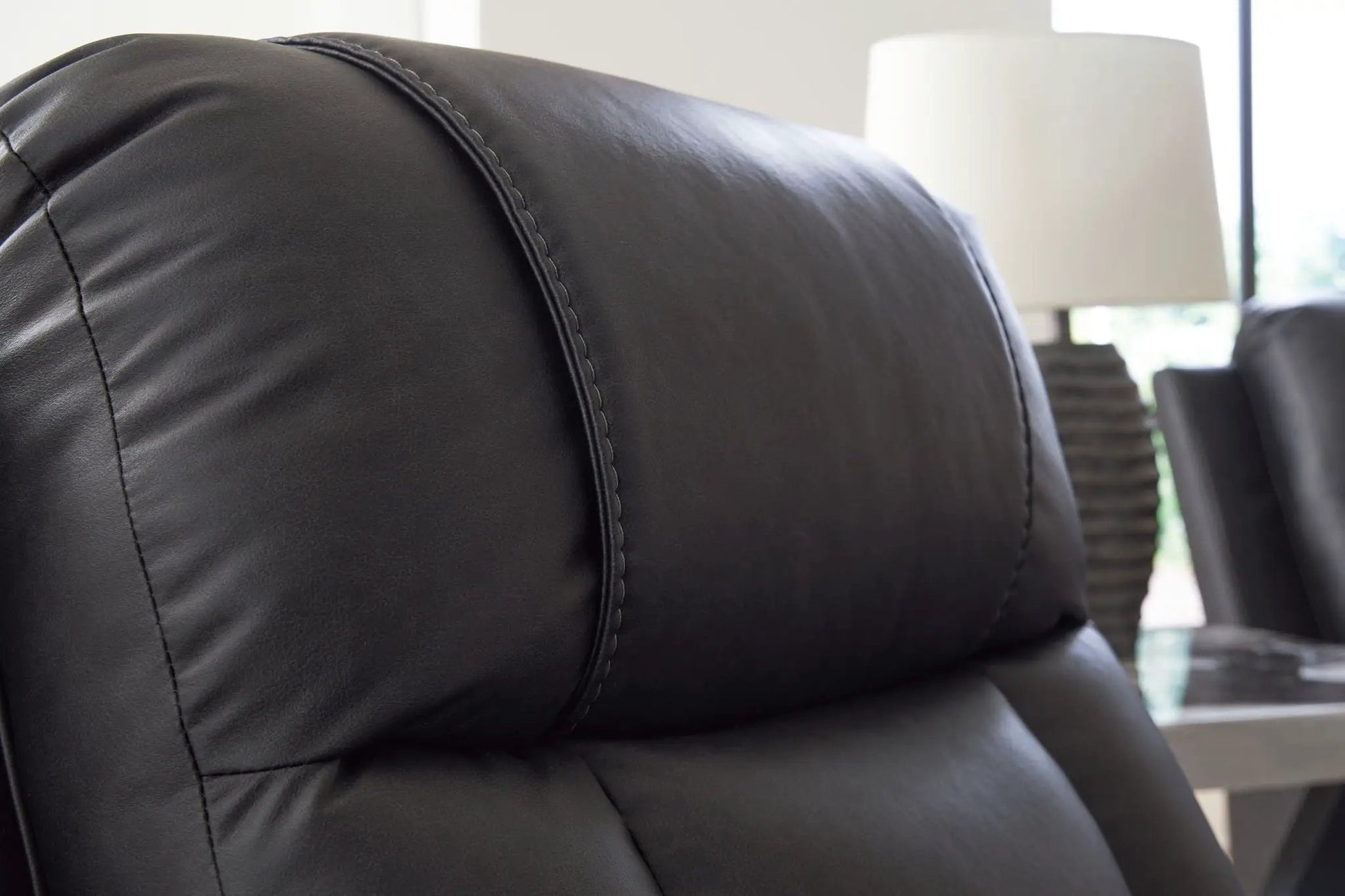 Mackmenville Zero Wall Recliner black leather close-up stitching on Tampa Home & Garden Store