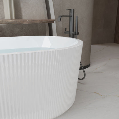 Modern double-wall freestanding soaker tub with white finish and dark matte faucet on Tampa Home & Garden Store