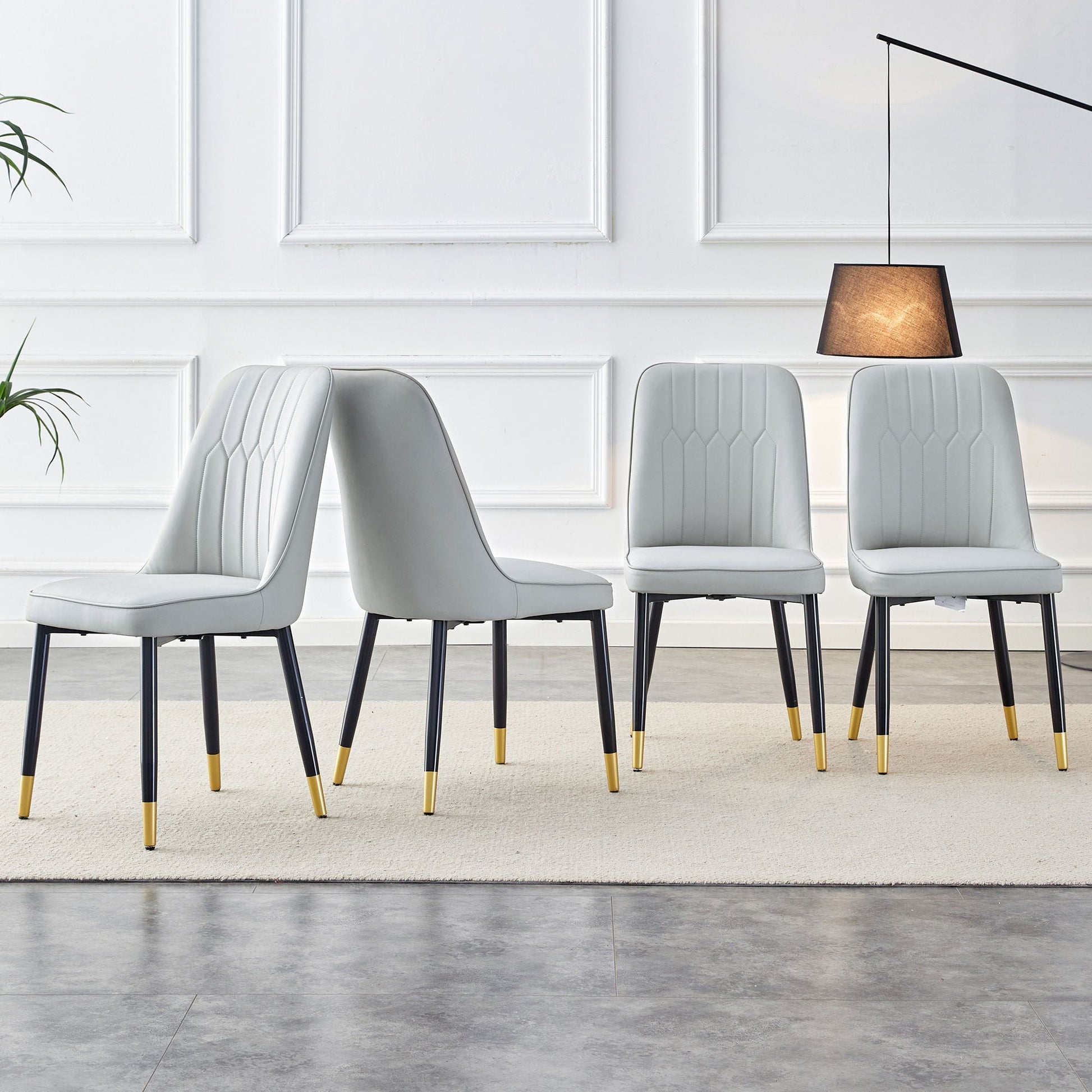 Modern chair with metal legs, gray seat, 4 chairs with black legs and gold tips by HouseOfZazla on Tampa Home & Garden Store