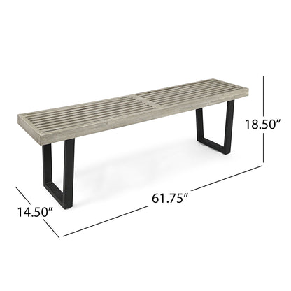 Outdoor dining bench with slat top in weathered wood and black metal legs on Tampa Home & Garden Store