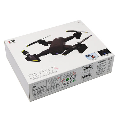 DM107S folding drone quadcopter dual camera 4K HD black body with yellow prop tips on a box on Tampa Home & Garden Store
