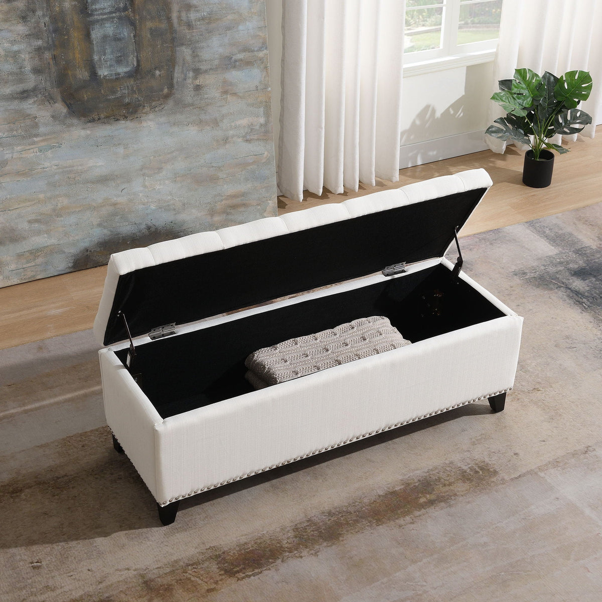 Button-tufted white storage ottoman with safety-close lid, interior storage and nailhead trim on Tampa Home & Garden Store