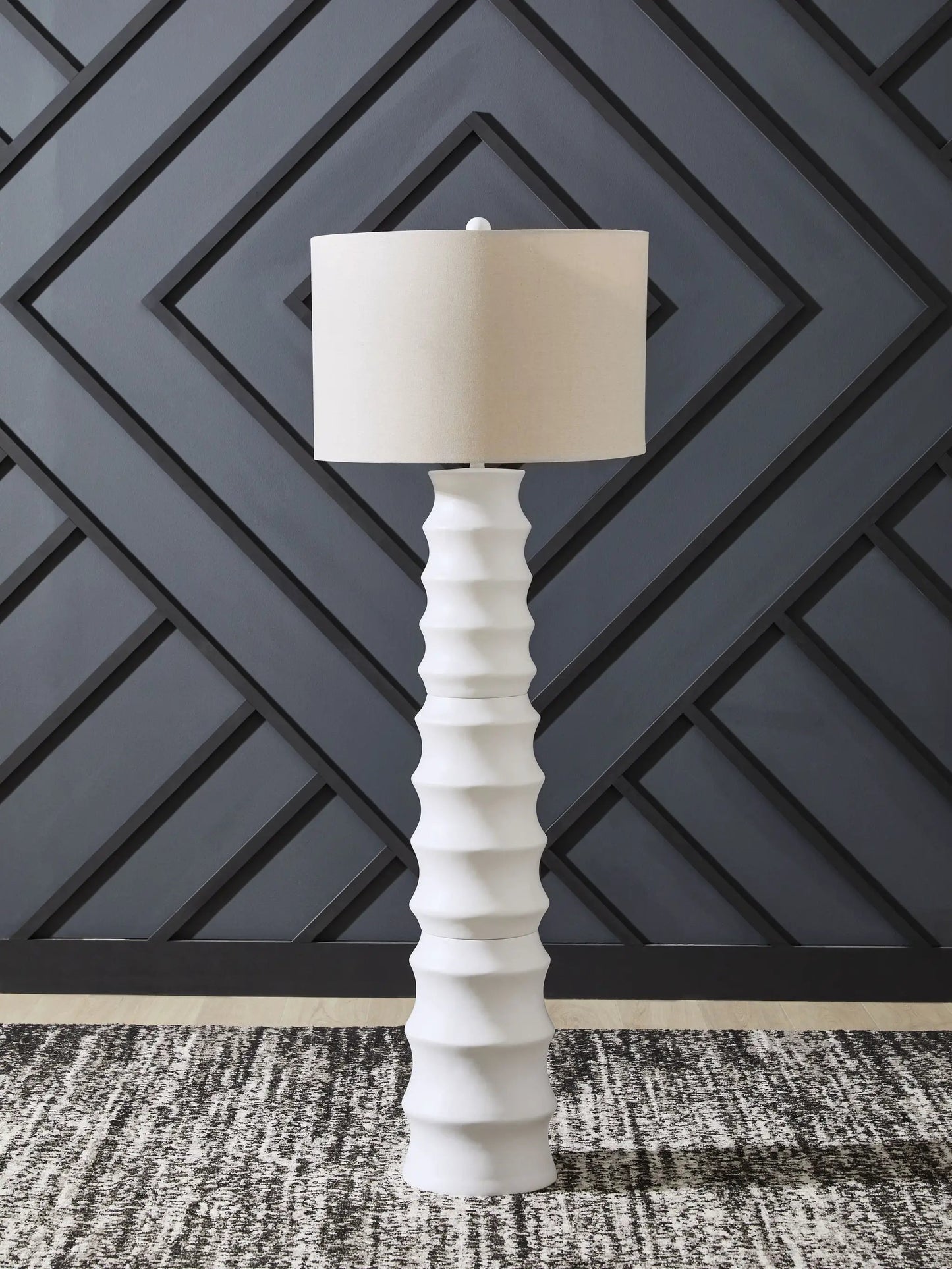 Veraleigh Poly Lamp by Unique Piece Furniture, white ribbed base with beige shade against a dark wall on Tampa Home & Garden Store