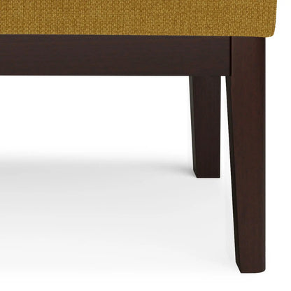 Carlson ottoman bench in mustard yellow textured fabric with dark walnut legs on Tampa Home & Garden Store