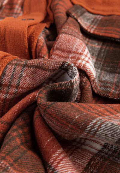 Plaid button-up jacket fabric close-up in orange-brown tones Stevvex on Tampa Home & Garden Store