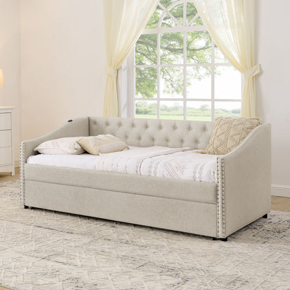 Beige upholstered daybed with tufted back and nailhead trim, simple bedroom display on Tampa Home & Garden Store
