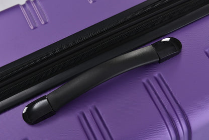 Hardshell luggage close-up in purple with black zipper tracks and molded handle on Tampa Home & Garden Store