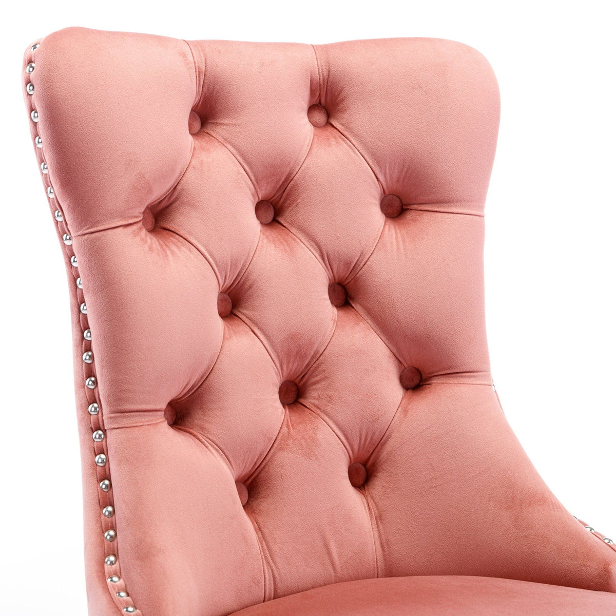 Tufted velvet dining chair in pink upholstery with silver nailhead trim on Tampa Home & Garden Store