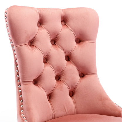 Tufted velvet dining chair in pink upholstery with silver nailhead trim on Tampa Home & Garden Store