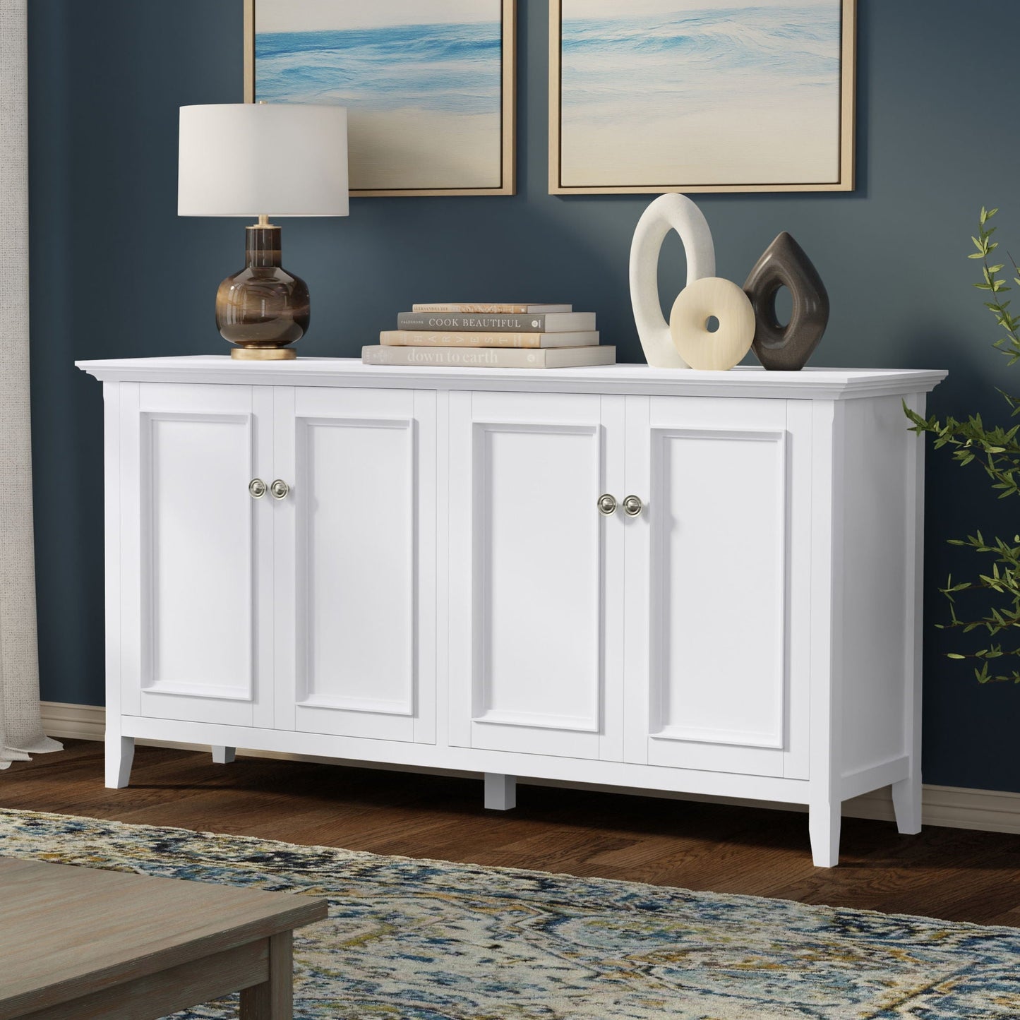 Amherst 4-Door Storage Cabinet white; lamp, books, and abstract sculptures on top on Tampa Home & Garden Store