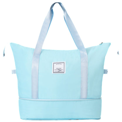 Light blue tote bag with wide gray straps and front label patch HouseOfZazla on Tampa Home & Garden Store