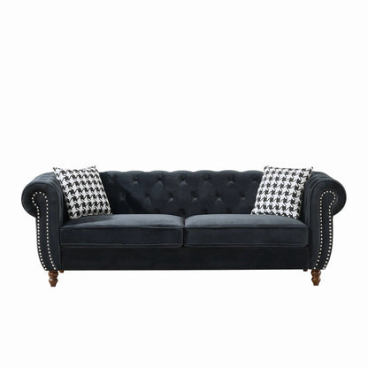 Chesterfield sofa with roll arms and nailhead trim in black fabric, 2 houndstooth pillows on Tampa Home & Garden Store