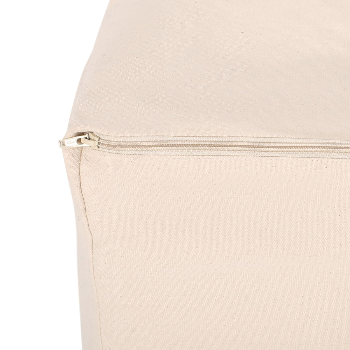 Rectangular pouf ottoman in natural beige fabric with exposed zipper along base on Tampa Home & Garden Store