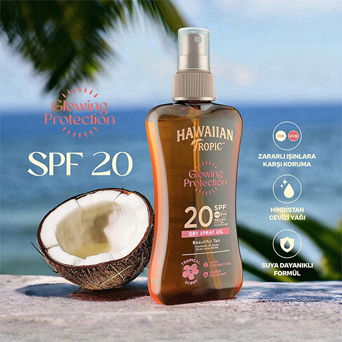 Hawaiian Tropic Glowing Protection SPF20 Dry Spray Oil bottle with coconut imagery on beach on Tampa Home & Garden Store
