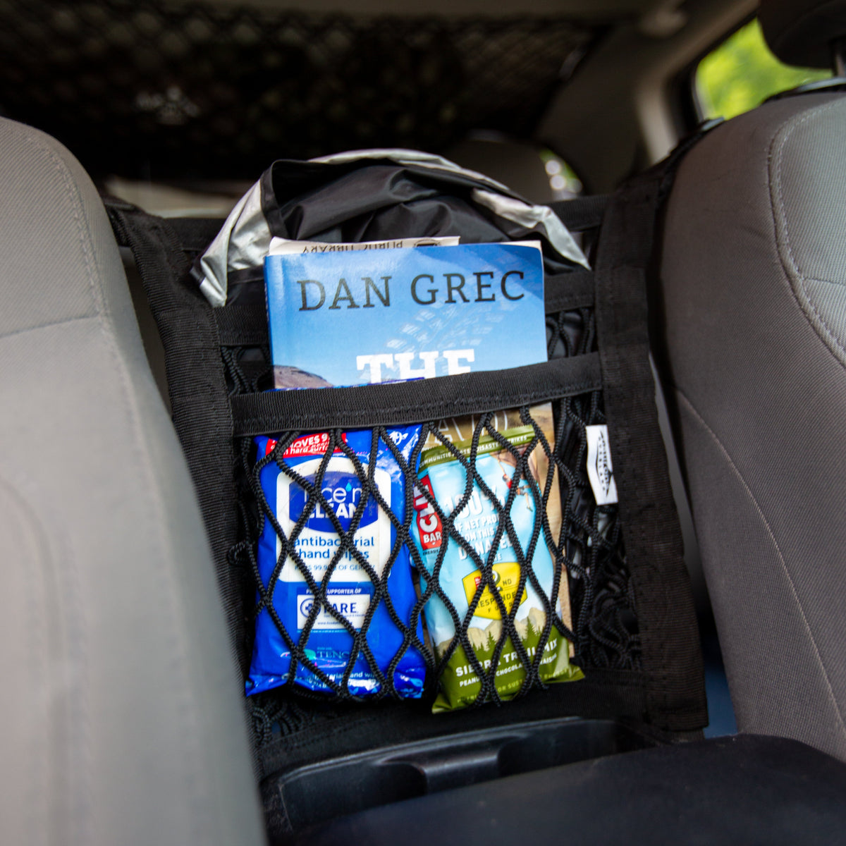 Deluxe Vehicle Organization Bundle black cargo net stabilizes items in car rear area on Tampa Home & Garden Store