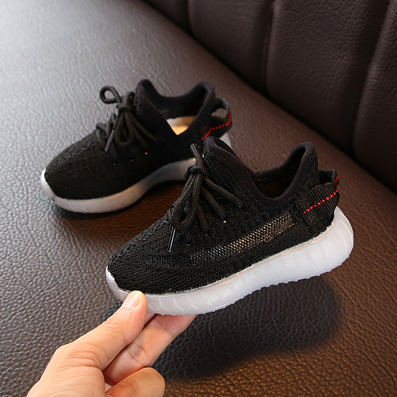 Pair of Stevvex black knit baby/toddler sneakers with white sole and red heel stripe on Tampa Home & Garden Store