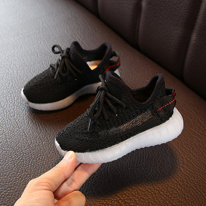 Pair of Stevvex black knit baby/toddler sneakers with white sole and red heel stripe on Tampa Home & Garden Store