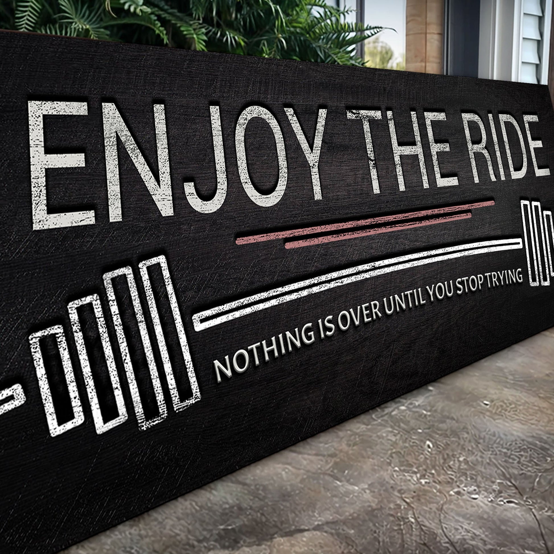 Enjoy The Ride gym sign canvas in black with distressed white typography and pink accent lines on Tampa Home & Garden Store