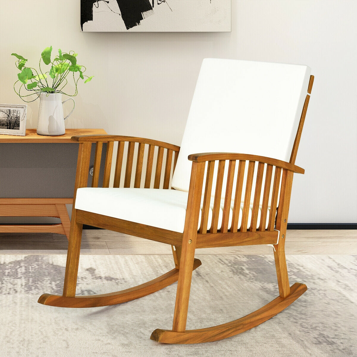 Mecedora de exterior de madera de acacia con cojines desmontables y lavables