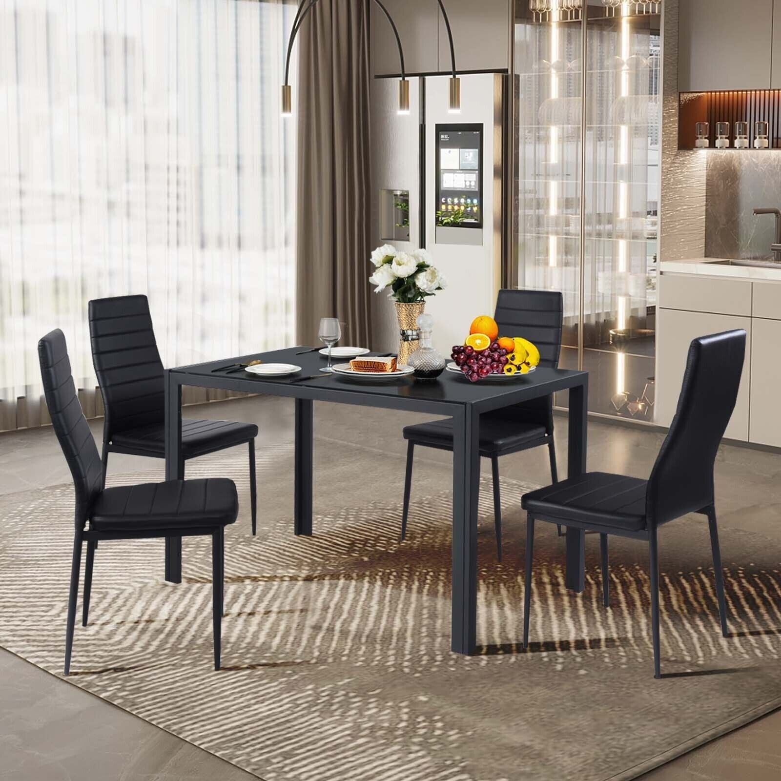 4-piece modern leather dining chair set with metal frame, black upholstery around a dark table on Tampa Home & Garden Store