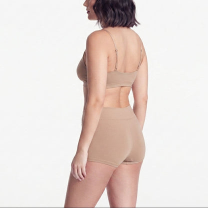 Boyshorts organic cotton beige on model, Net Positive brand, back view on Tampa Home & Garden Store
