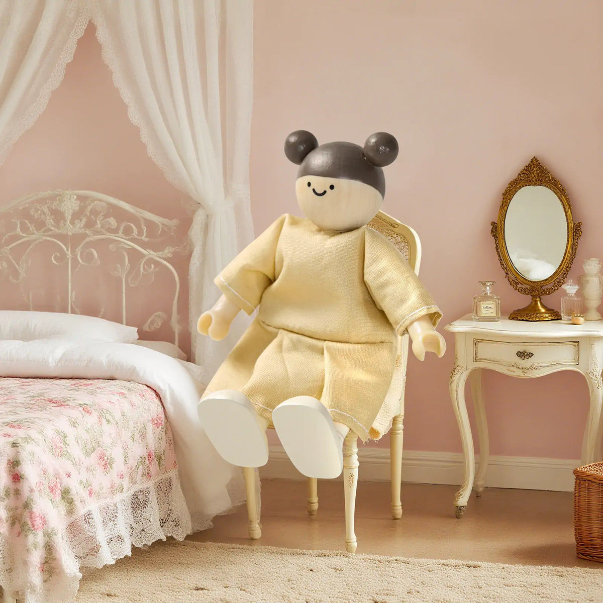 Dollhouse doll Tiny Land in beige dress on cream chair in pastel bedroom with lace canopy on Tampa Home & Garden Store