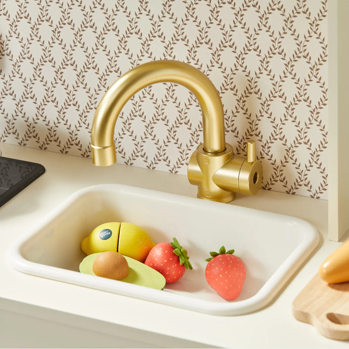 Tiny Land PopJoy Play Kitchen gold faucet and sink with toy fruit in basin on Tampa Home & Garden Store