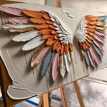 Angelic Wings Wall Art canvas with white and orange feather wings, pink, blue and gold accents on Tampa Home & Garden Store