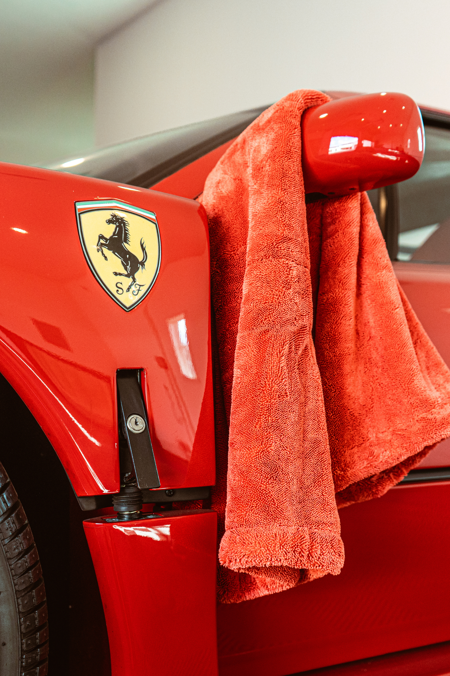 BLACKLINE Twisted-Loop Drying Towel red terry towel draped over car mirror on Tampa Home & Garden Store
