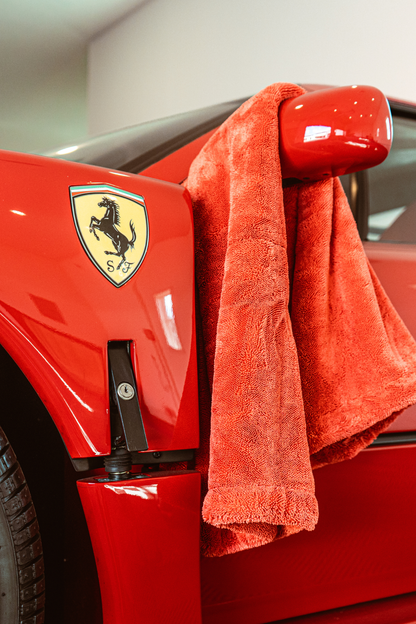 BLACKLINE Twisted-Loop Drying Towel red terry towel draped over car mirror on Tampa Home & Garden Store