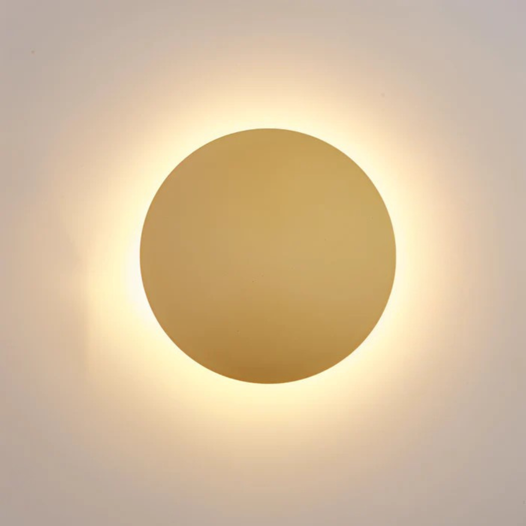 Modern LED Wall Lamp by Moktan Sabai, round wall light fixture with warm golden glow on Tampa Home & Garden Store