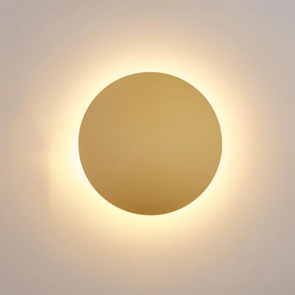 Modern LED Wall Lamp by Moktan Sabai, round wall light fixture with warm golden glow on Tampa Home & Garden Store