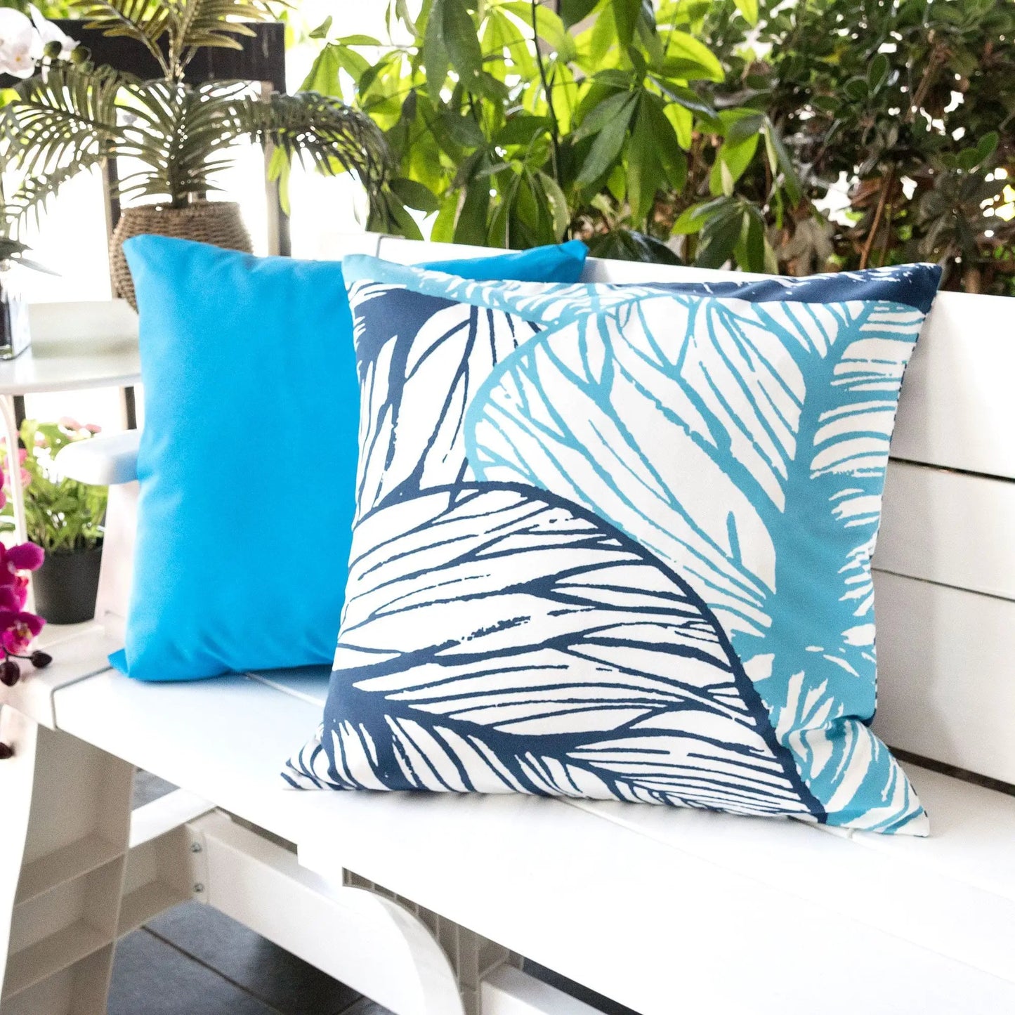 Leaf Vein Outdoor & Indoor Pillow Indigo blue palm pattern, 2 pillows on white bench on Tampa Home & Garden Store